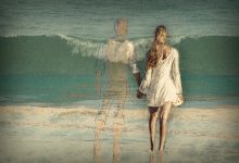 A faded drawing of a couple on the beach