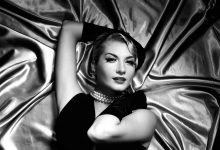 A film noir actress lay on a bed