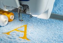 A letter A being sewn onto fabric